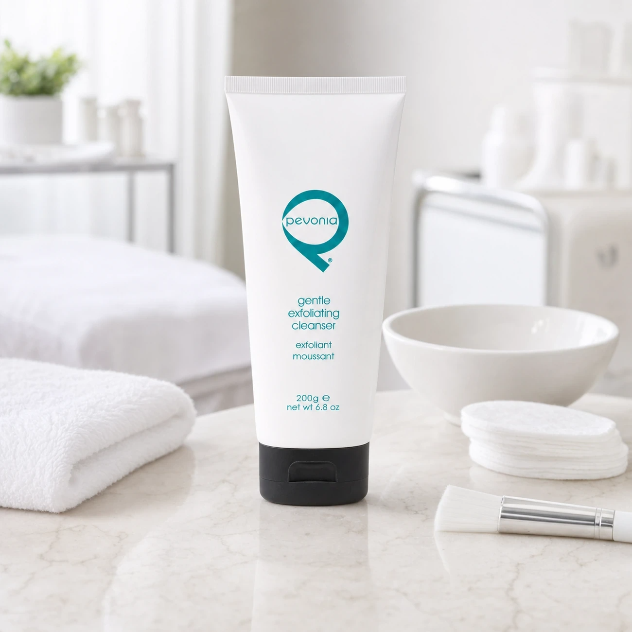 Pevonia Gentle Exfoliating Cleanser 200g professional tube styled in a clean clinic treatment setting for Beauty Collective Pro.