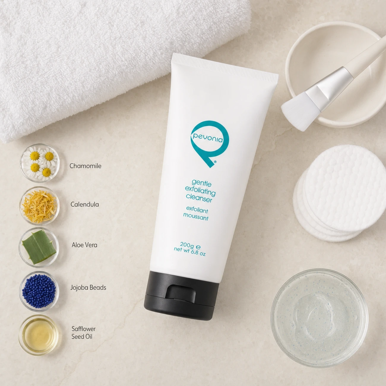 Pevonia Gentle Exfoliating Cleanser 200g treatment-support flatlay with chamomile, calendula, aloe vera, jojoba beads and safflower seed oil references.