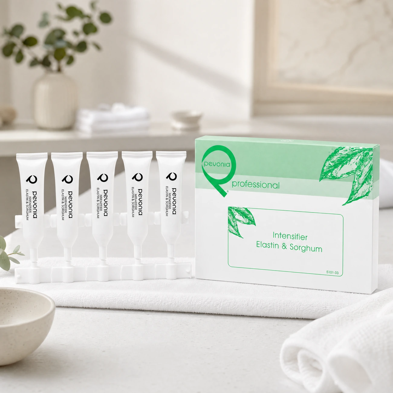 Pevonia Intensifier Elastin and Sorghum 5 x 5ml professional ampoule kit and box styled in a serene clinical spa treatment room for Beauty Collective Pro.