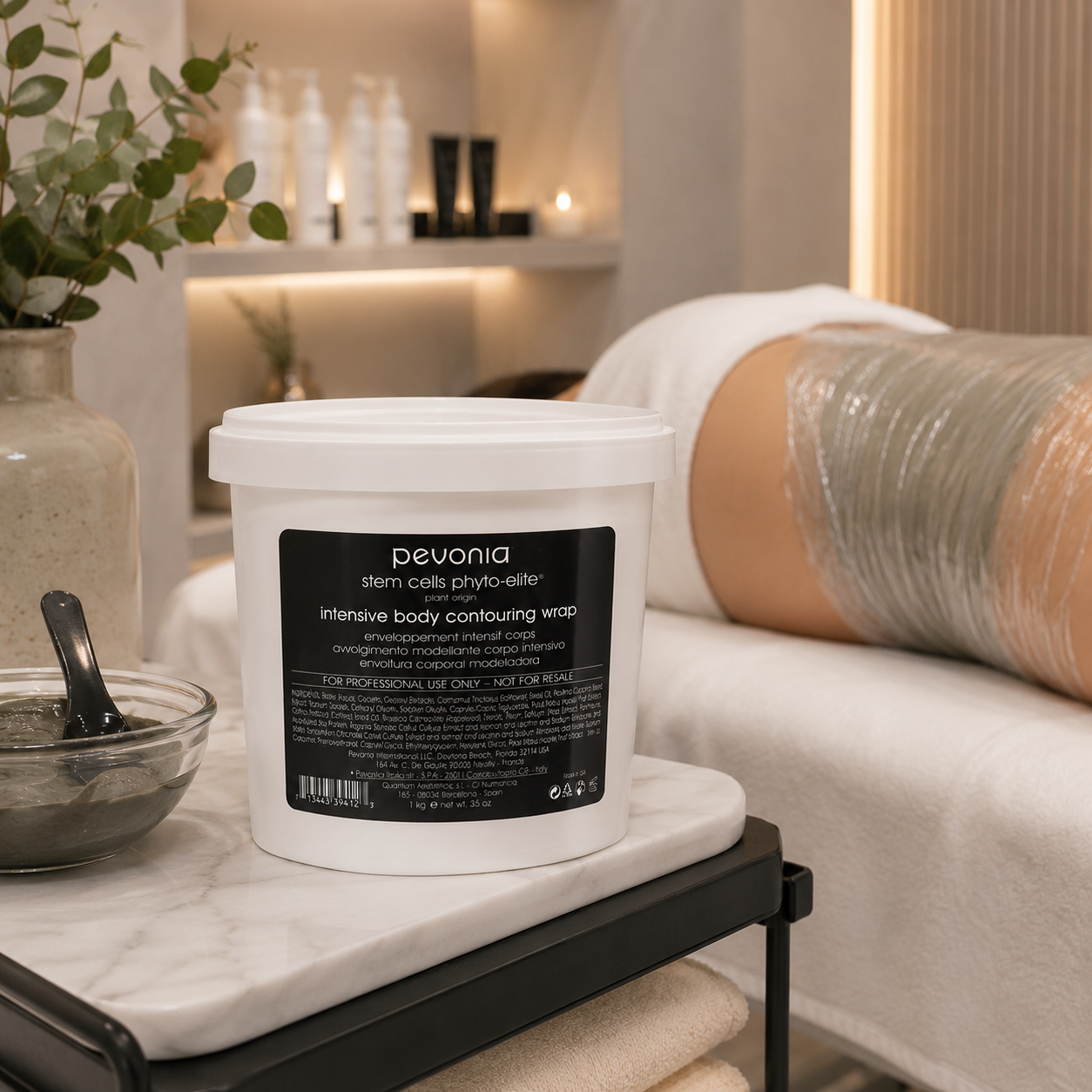 Pevonia Stem Cells Intensive Body Contouring Wrap 1kg displayed in a luxury spa body wrap treatment room for professional contouring treatments.