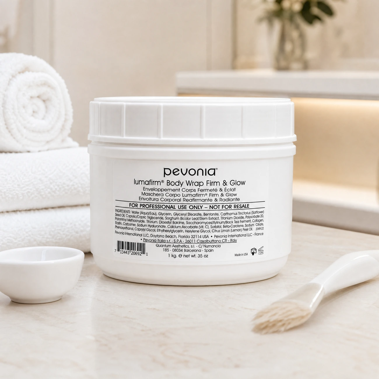 Pevonia Lumafirm Body Wrap Firm & Glow 1kg professional tub styled in a serene clinical spa treatment room for Beauty Collective Pro.