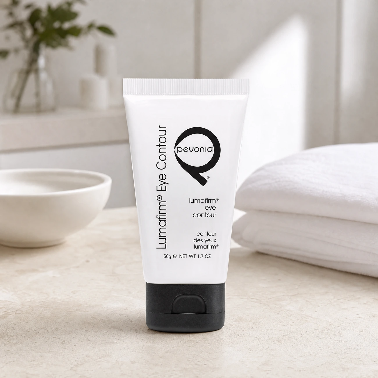 Pevonia Lumafirm Eye Contour Lift & Glow 50g professional white tube styled in a serene clinical spa treatment room for Beauty Collective Pro.