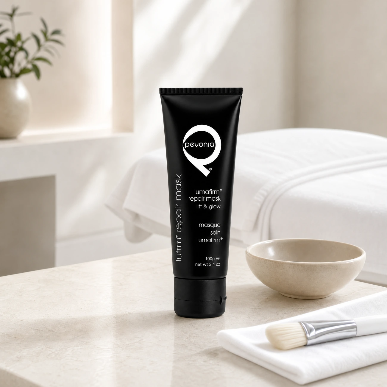 Pevonia Lumafirm Repair Mask 100ml professional matte-black tube styled in a serene clinical spa treatment room for Beauty Collective Pro.