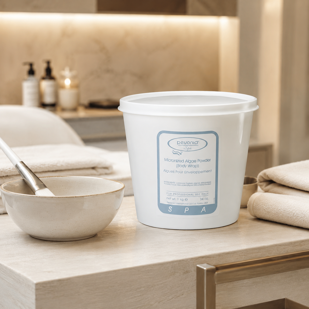 Pevonia Micronized Algae Powder Body Wrap 1kg tub displayed in an upmarket day spa body treatment room with unbranded body wrap treatment accessories.