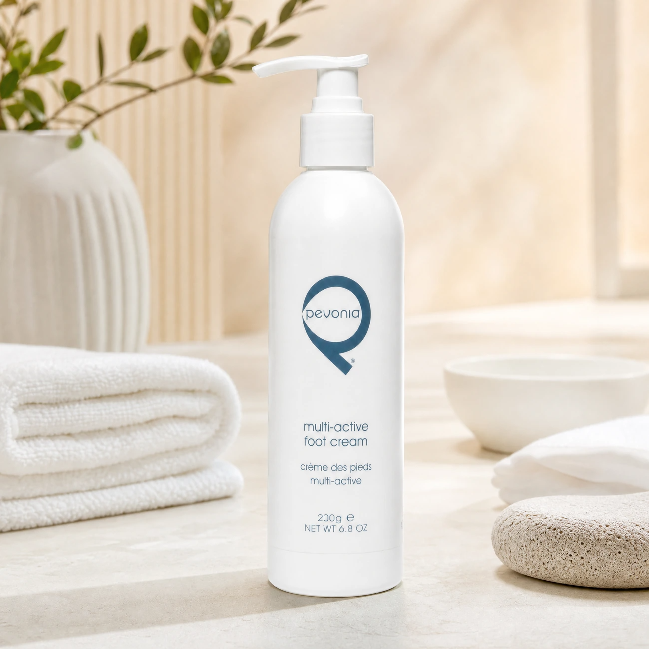 Pevonia Multi-Active Foot Cream 200g professional pump bottle styled in a serene clinical spa pedicure treatment room for Beauty Collective Pro.
