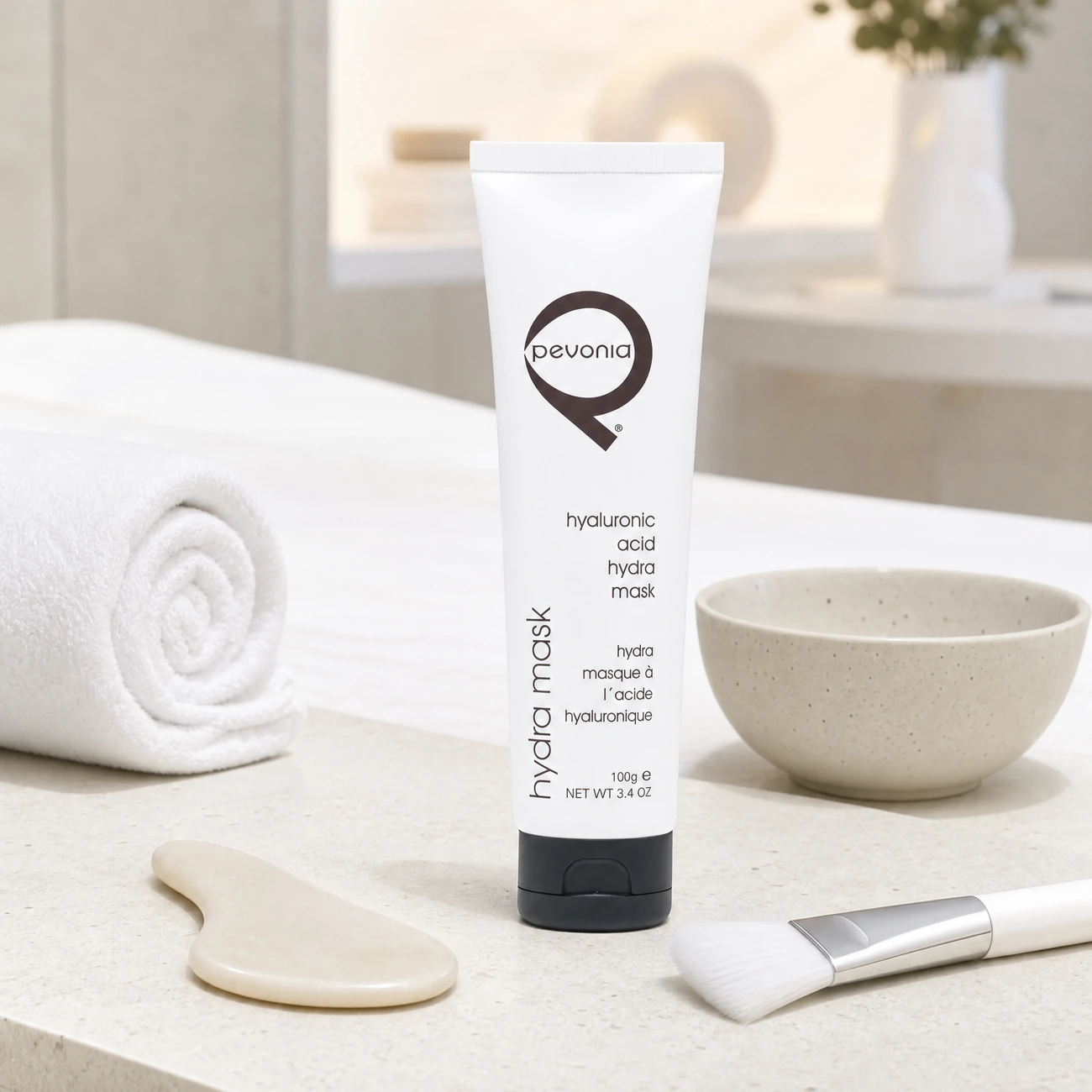 Pevonia Power Repair Hyaluronic Acid Hydra Mask 100g professional white tube styled in a serene clinical spa treatment room for Beauty Collective Pro.