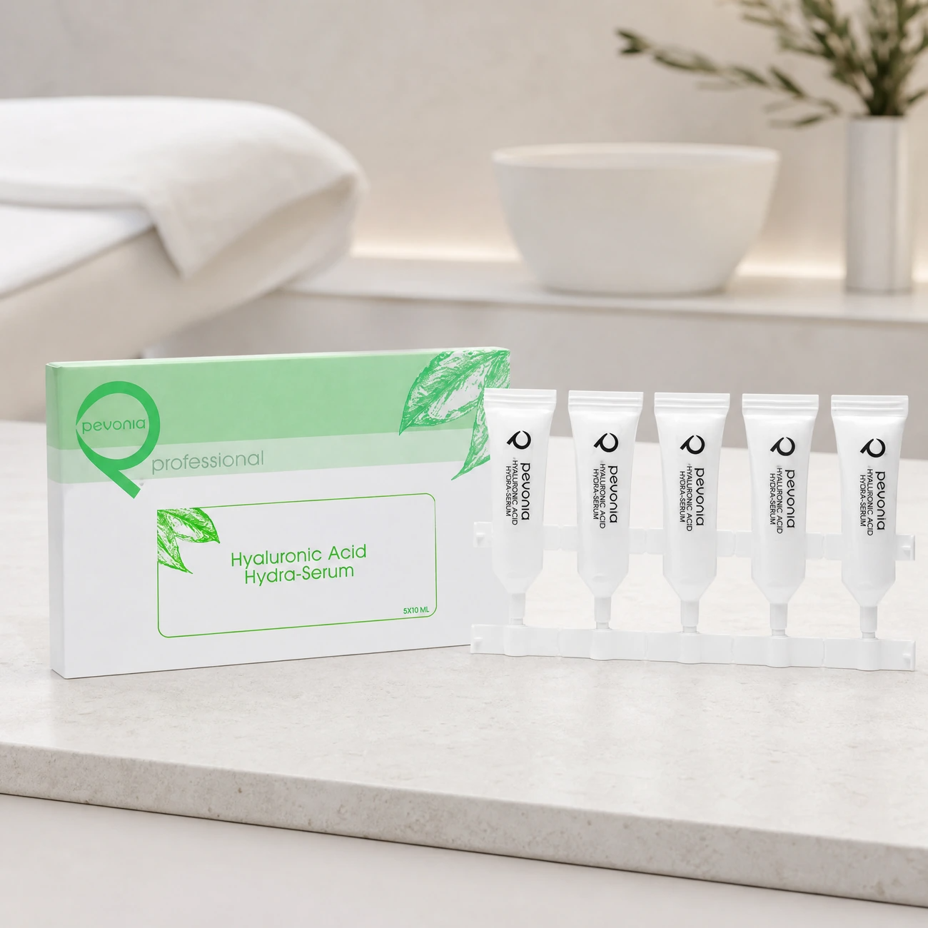 Pevonia Power Repair Hyaluronic Acid Hydra-Serum 5-pack professional kit and box styled in a serene clinical spa treatment room for Beauty Collective Pro.