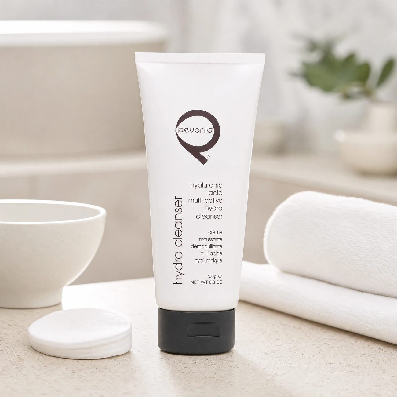 Pevonia Power Repair Hyaluronic Acid Multi-Active Hydra Cleanser 200g professional white tube styled in a serene clinical spa treatment room for Beauty Collective Pro.