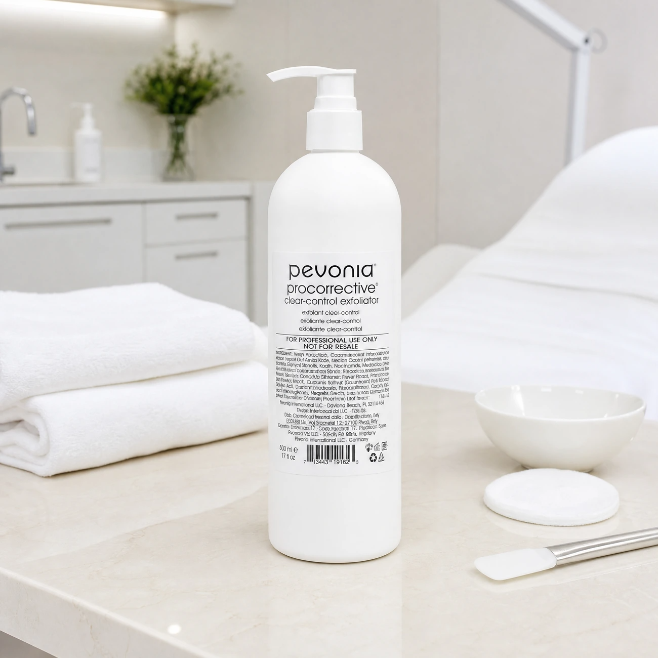 Pevonia ProCorrective Clear-Control Exfoliator 500ml professional white pump bottle styled in a serene clinical spa treatment room for Beauty Collective Pro.