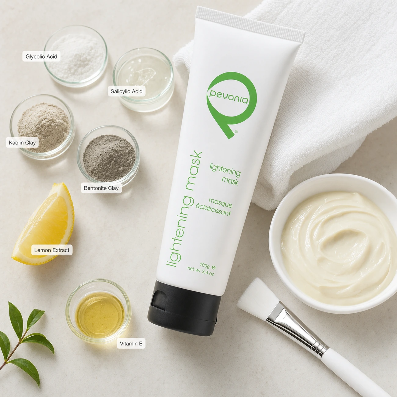 Pevonia Radiance Lightening Mask 100ml treatment-support flatlay with glycolic acid, salicylic acid, kaolin clay, bentonite clay, vitamin E and lemon extract references.