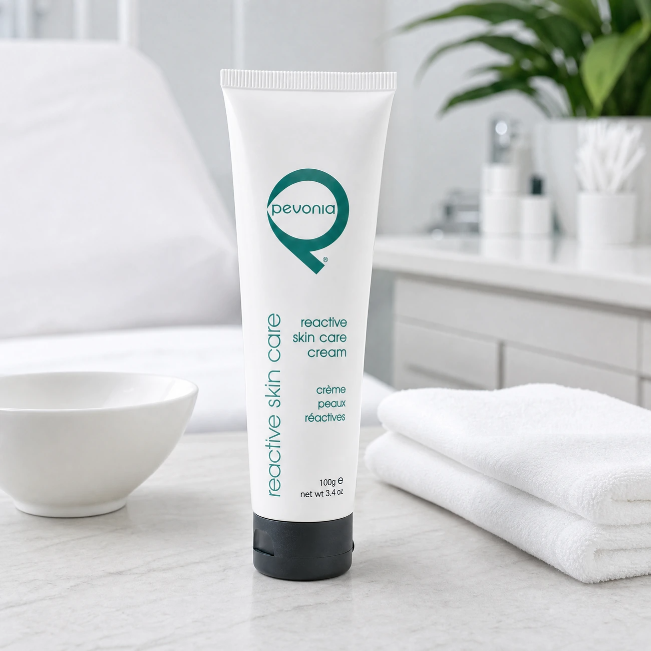 Pevonia Reactive Skin Care Cream 100ml professional white tube styled in a serene clinical spa treatment room for Beauty Collective Pro.