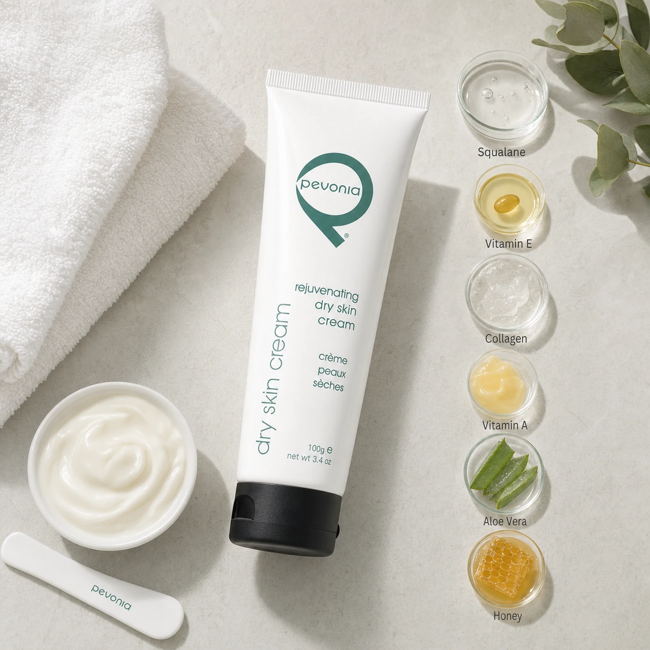 Pevonia Rejuvenating Dry Skin Cream 100ml treatment-support flatlay with squalane, vitamin E, collagen, vitamin A, aloe vera and honey references.