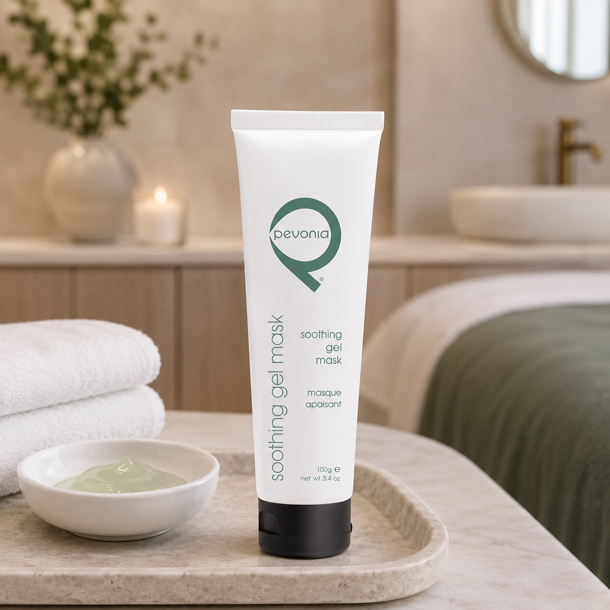 Pevonia Soothing Gel Mask 100g tube displayed in an upmarket day spa treatment room with unbranded mask treatment accessories.