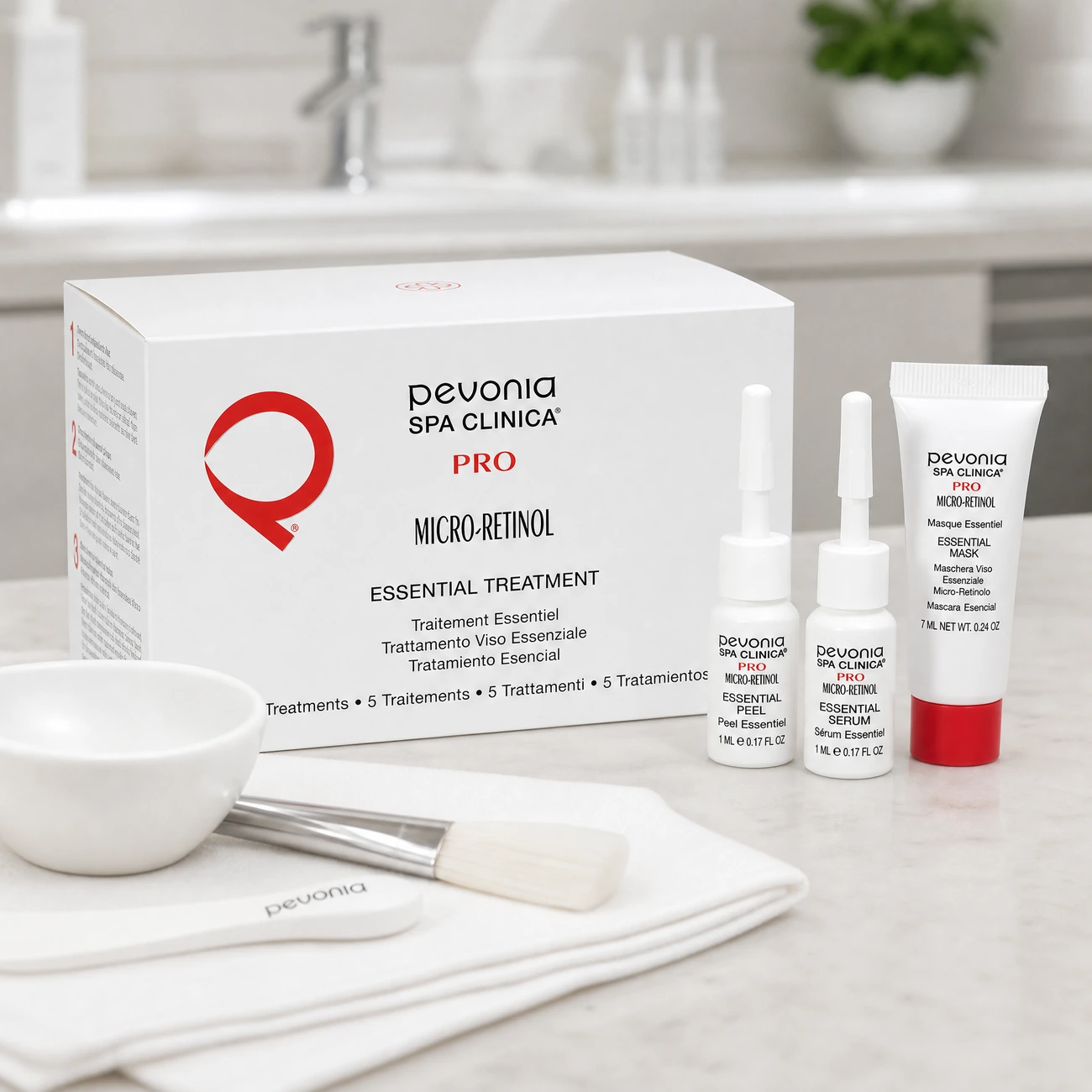 Pevonia Spa Clinica PRO Micro-Retinol Essential Treatment 5-pack box, peel and serum vials, and mask tube styled in a clinical medical spa treatment room for Beauty Collective Pro.