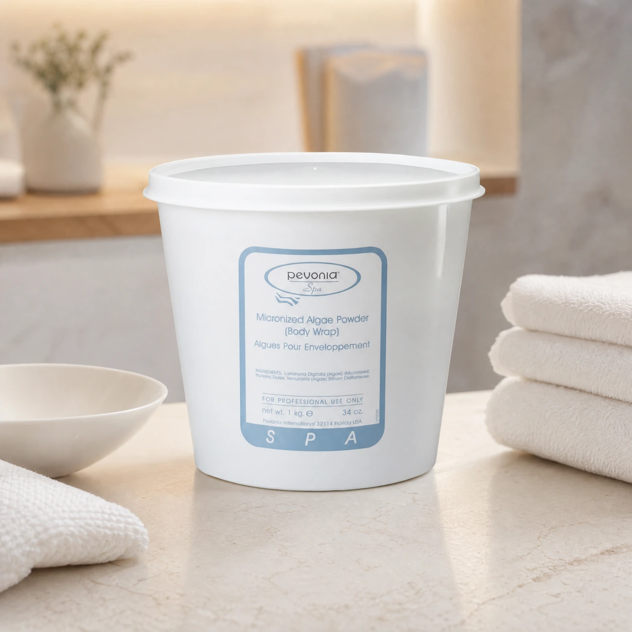 Pevonia Spa Micronized Algae Powder Body Wrap 1kg professional tub styled in a serene luxury day spa body treatment room for Beauty Collective Pro.
