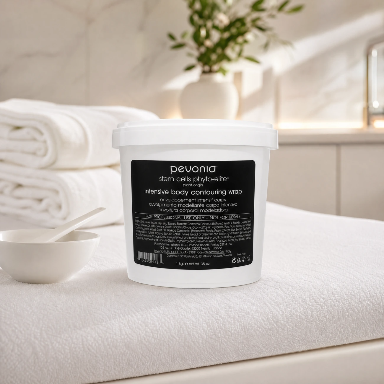 Pevonia Stem Cells Phyto-Elite Intensive Body Contouring Wrap 1kg professional tub styled in a serene clinical spa treatment room for Beauty Collective Pro.