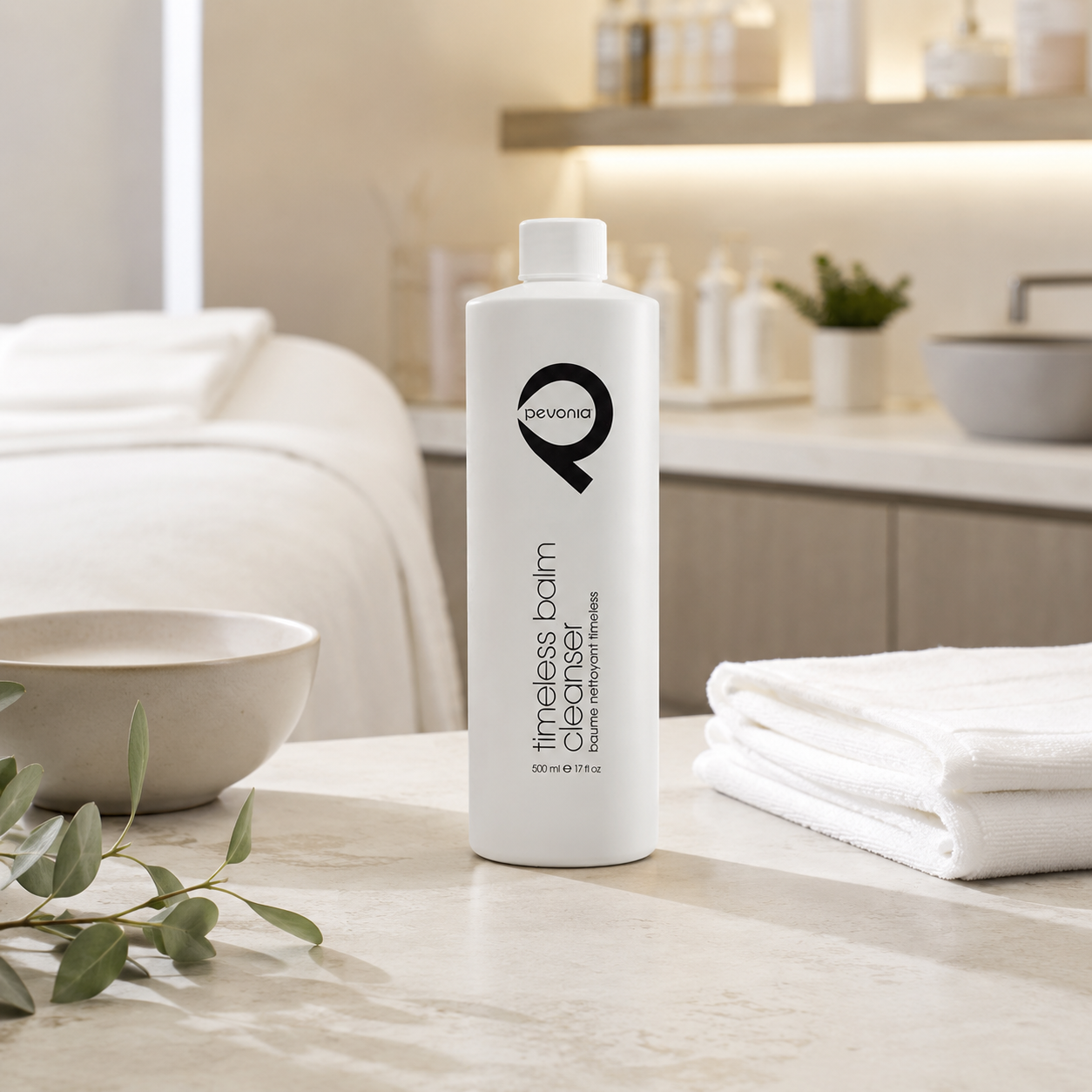 Pevonia Timeless Balm Cleanser 500ml displayed in an upmarket day spa treatment room for a nourishing, conditioning professional cleanse.