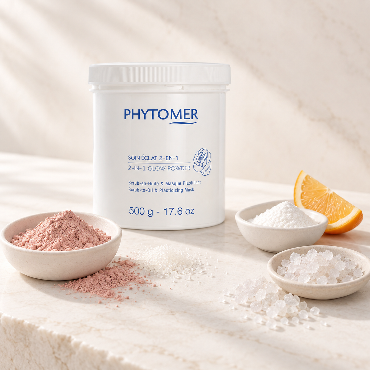PHYTOMER 2-in-1 Glow Powder 500g ingredient flatlay with pink clay, sugar crystals, vitamin C and sea minerals