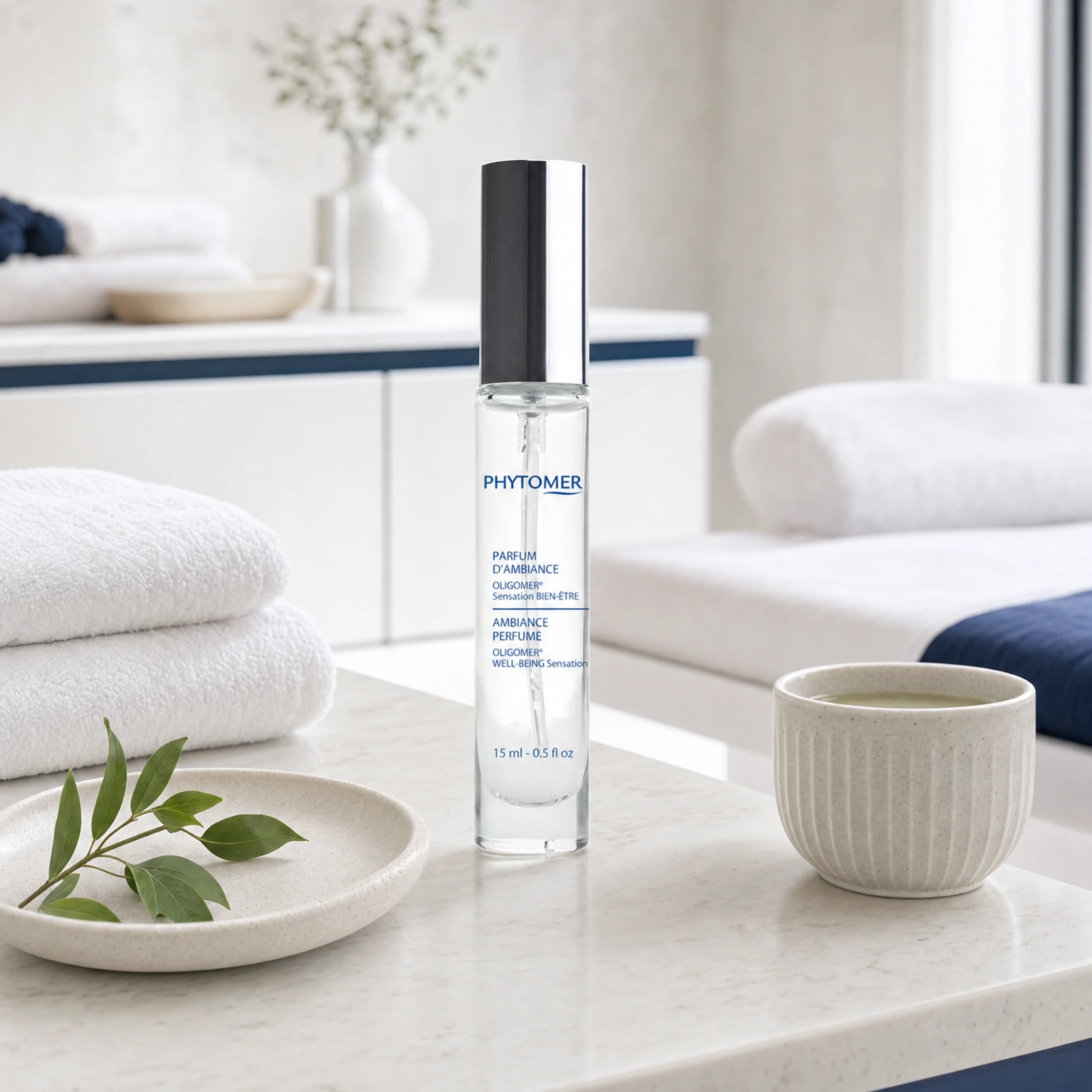 Phytomer Ambiance Perfume OLIGOMER Well-Being Sensation 15ml displayed in a professional spa treatment room for calming ambiance and wellness ritual use.