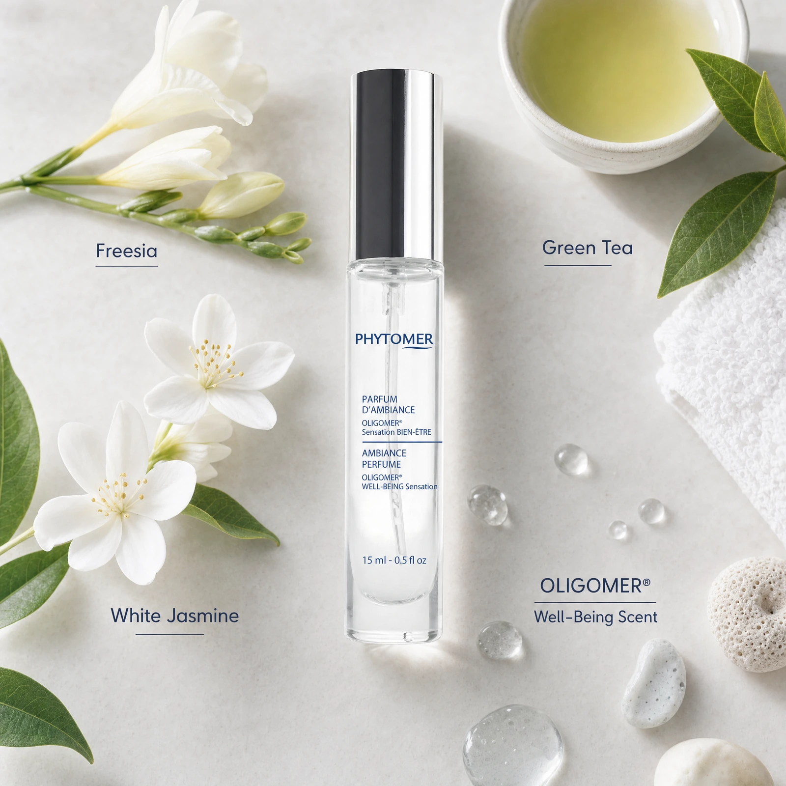 Phytomer Ambiance Perfume OLIGOMER Well-Being Sensation 15ml sensory-note flatlay featuring freesia, white jasmine, green tea and OLIGOMER well-being fragrance cues.