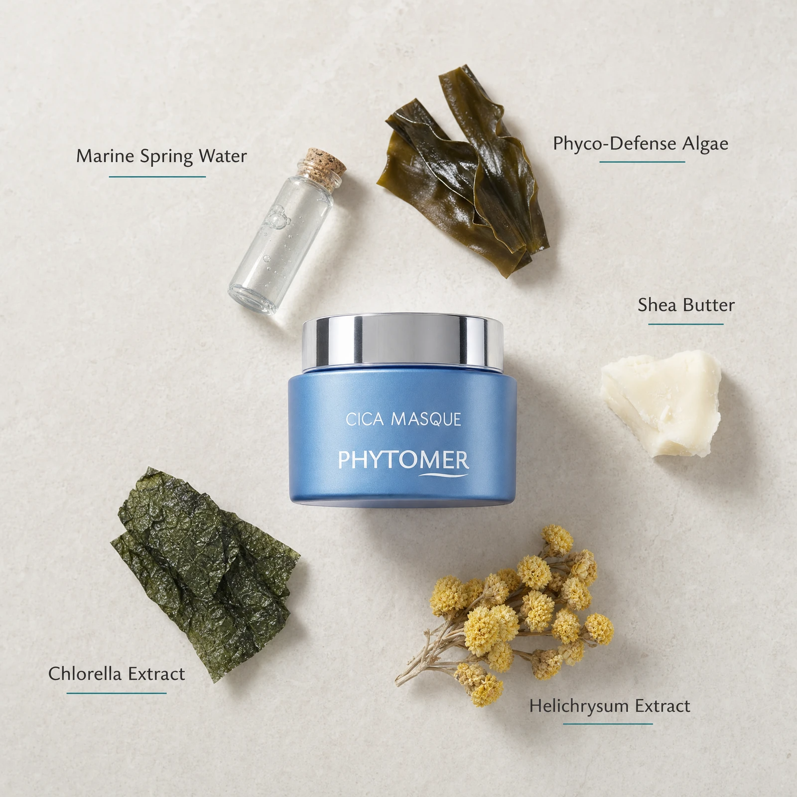 Phytomer Cica Masque Soothing Ultra-Nourishing Mask 50ml flatlay on limestone surface with Marine Spring Water, Phyco-Defense Algae, Shea Butter, Chlorella Extract, and Helichrysum Extract
