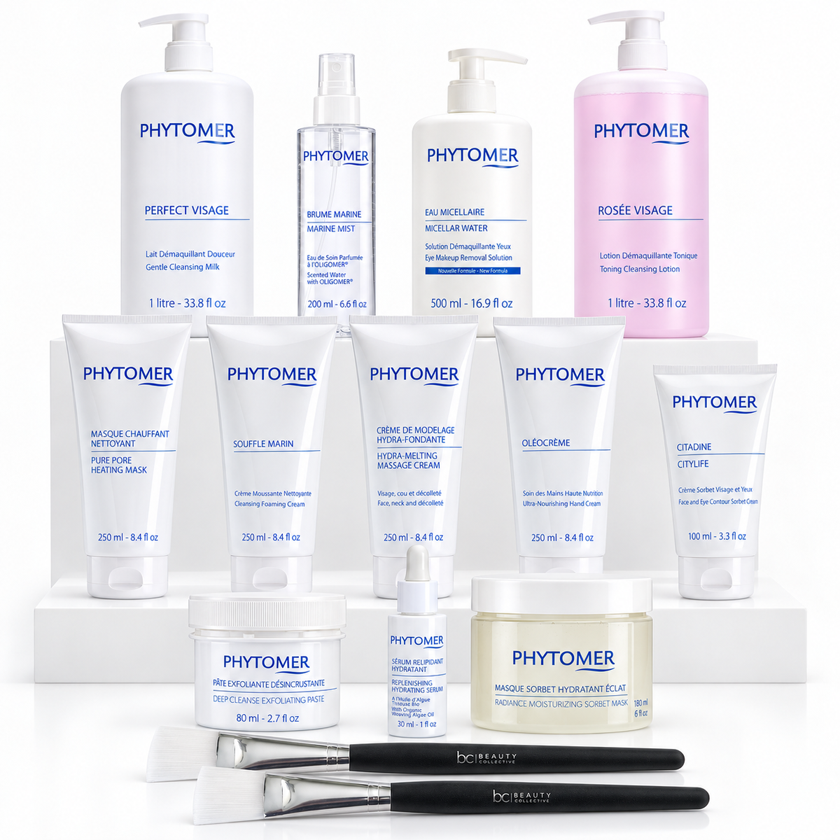 All 12 PHYTOMER CITYLIFE treatment products and two face mask brushes arranged on white display stands.