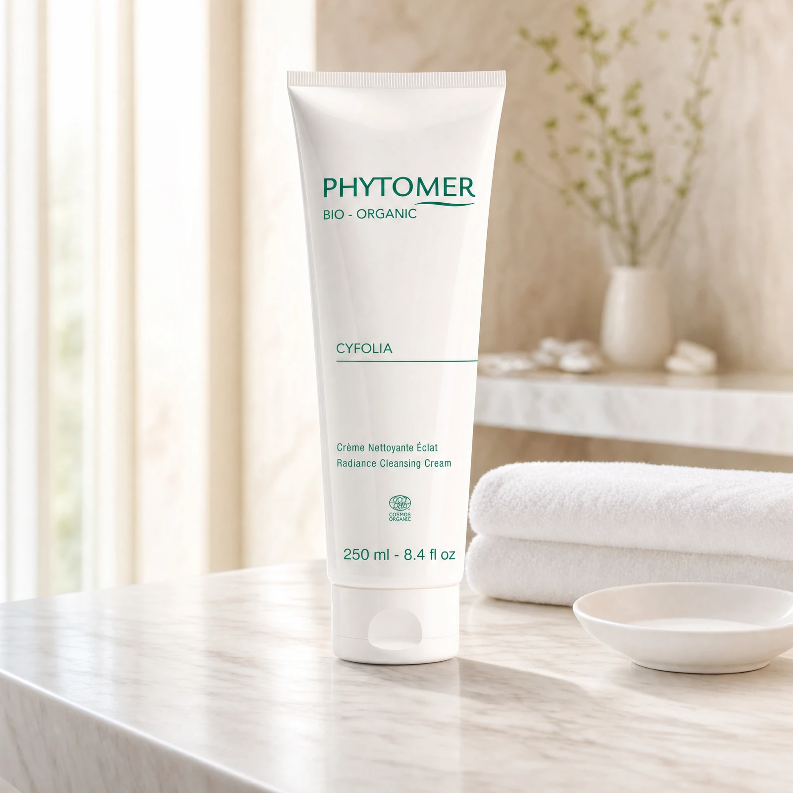 Phytomer Cyfolia Organic Radiance Cleansing Cream 250ml professional tube on a premium beauty clinic marble counter with white spa towels and ceramic dish
