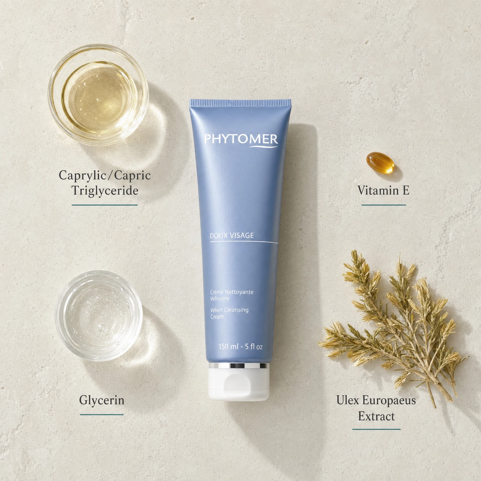 Phytomer Doux Visage Velvet Cleansing Cream 150ml flatlay on limestone surface with Caprylic/Capric Triglyceride, Vitamin E, Glycerin, and Ulex Europaeus Extract