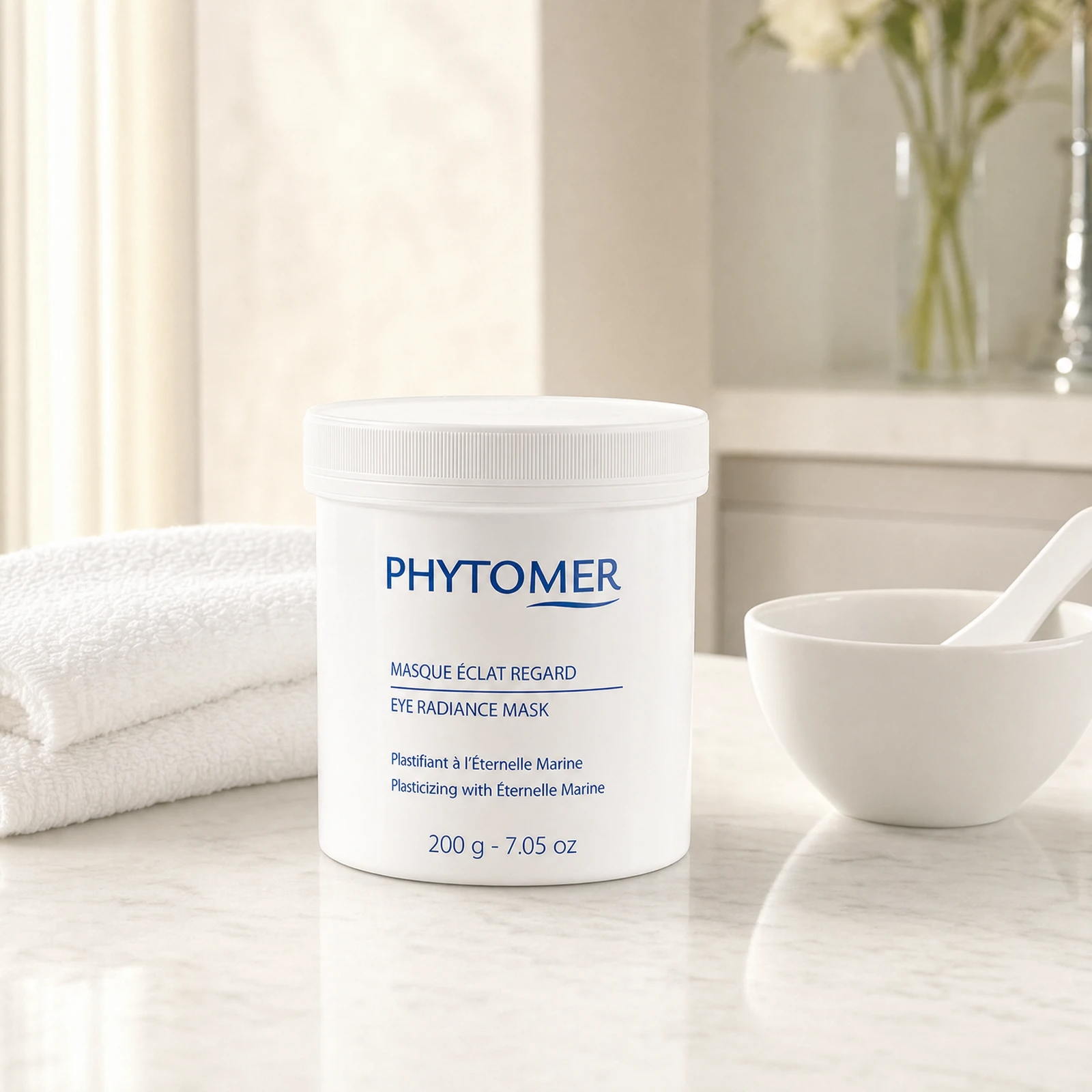 Phytomer Eye Radiance Mask Plasticizing with Eternelle Marine 200g professional tub on a premium beauty clinic marble counter with white spa towels and ceramic mixing bowl
