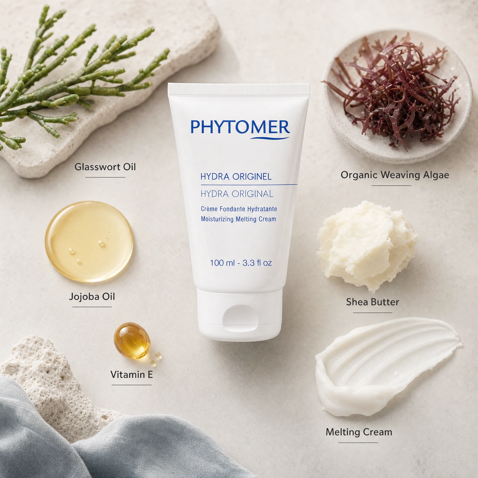 Phytomer Hydra Original Moisturising Melting Cream 100ml ingredient flatlay with Glasswort Oil, Organic Weaving Algae, Jojoba Oil, Shea Butter, Vitamin E and Melting Cream.