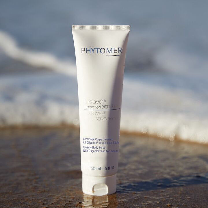 Phytomer skincare product on a beach with ocean waves in the background