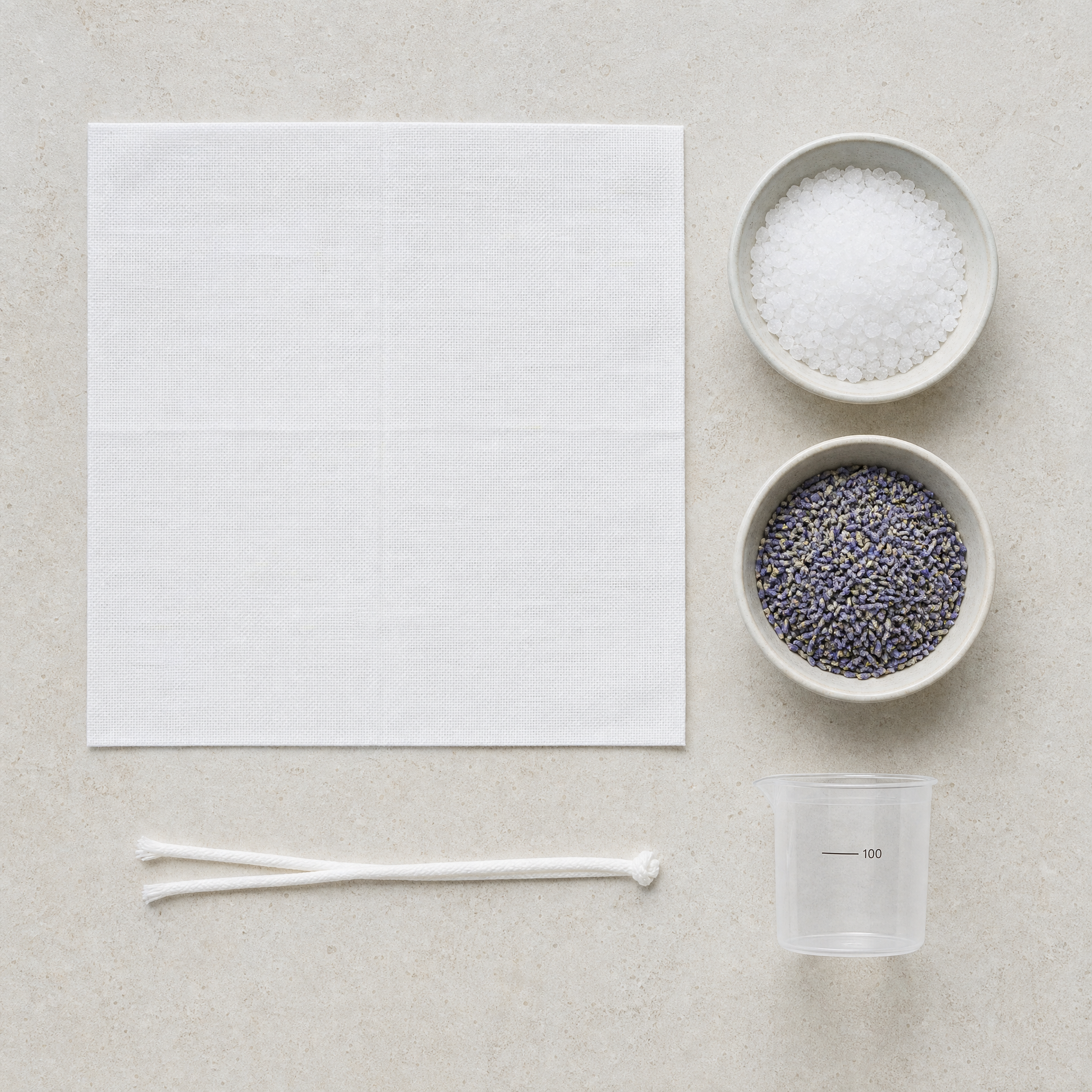 Phytomer Marine Bolus preparation materials including a fabric square, white ties, Marine Salt Crystals, Lavender Flowers and 100-line measuring cup