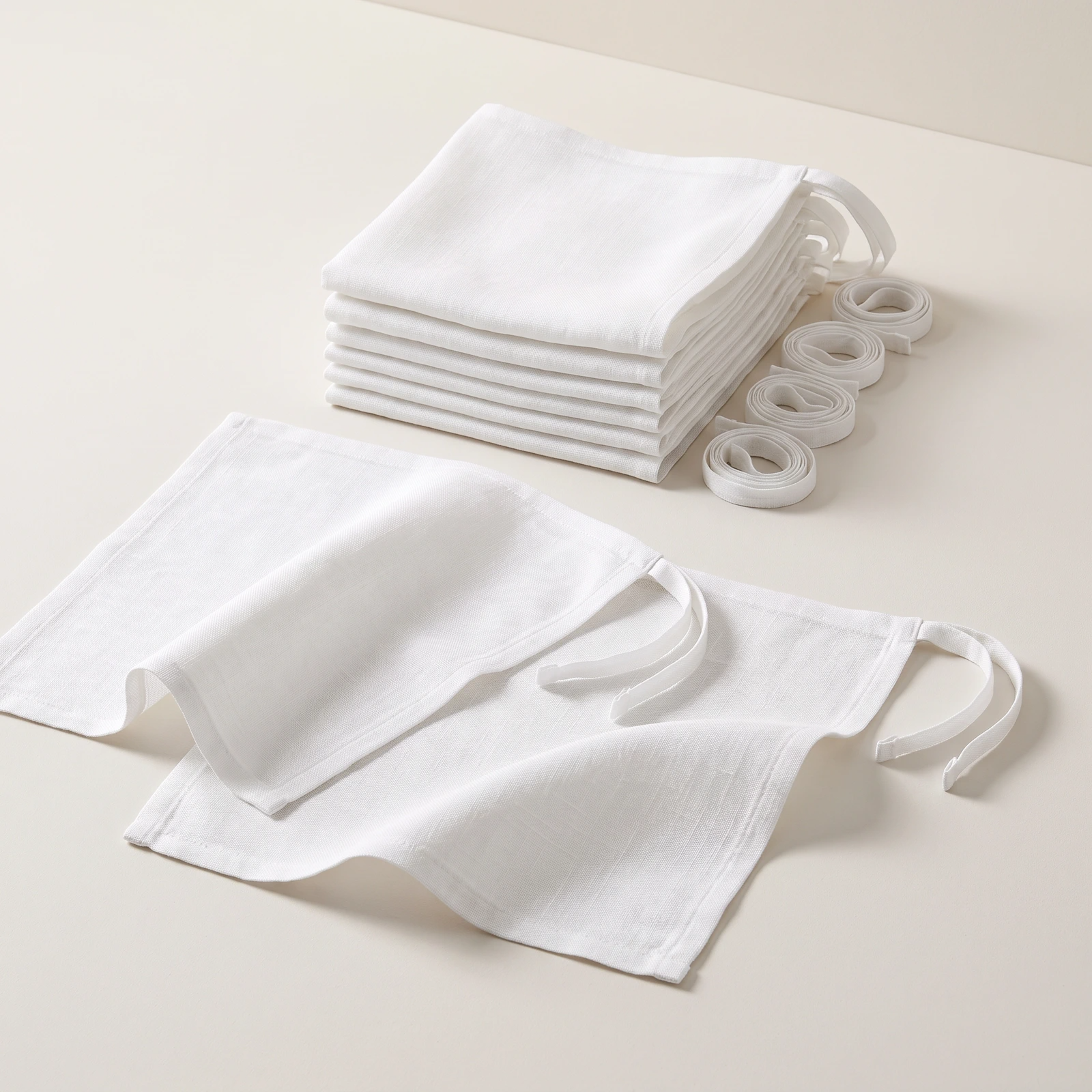 White linen marine bolus fabric squares with matching ties arranged to show the contents of the 8-pack