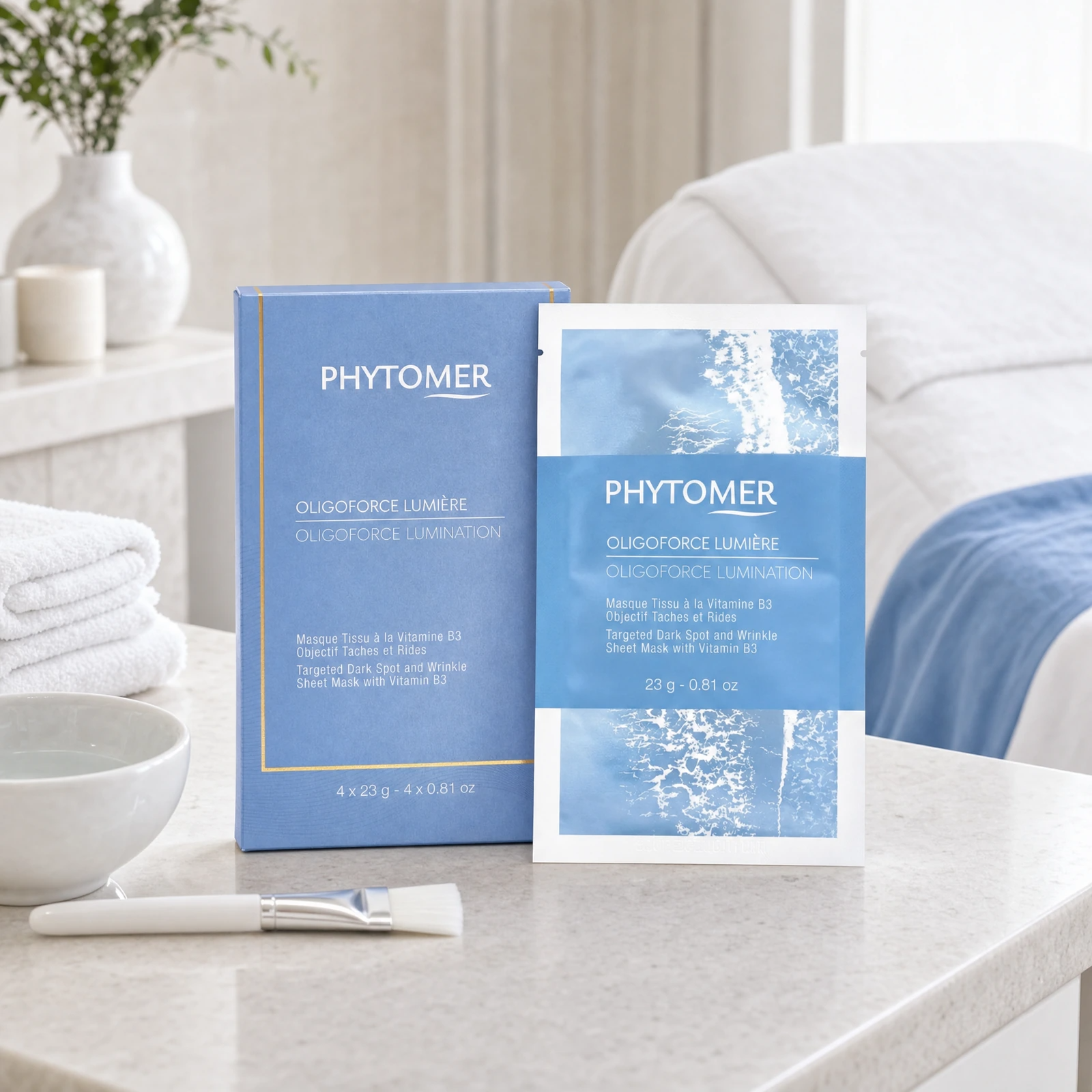 Phytomer Oligoforce Lumination Targeted Dark Spot and Wrinkle Sheet Mask with Vitamin B3 displayed in a professional spa treatment room for radiance and brightening treatments.
