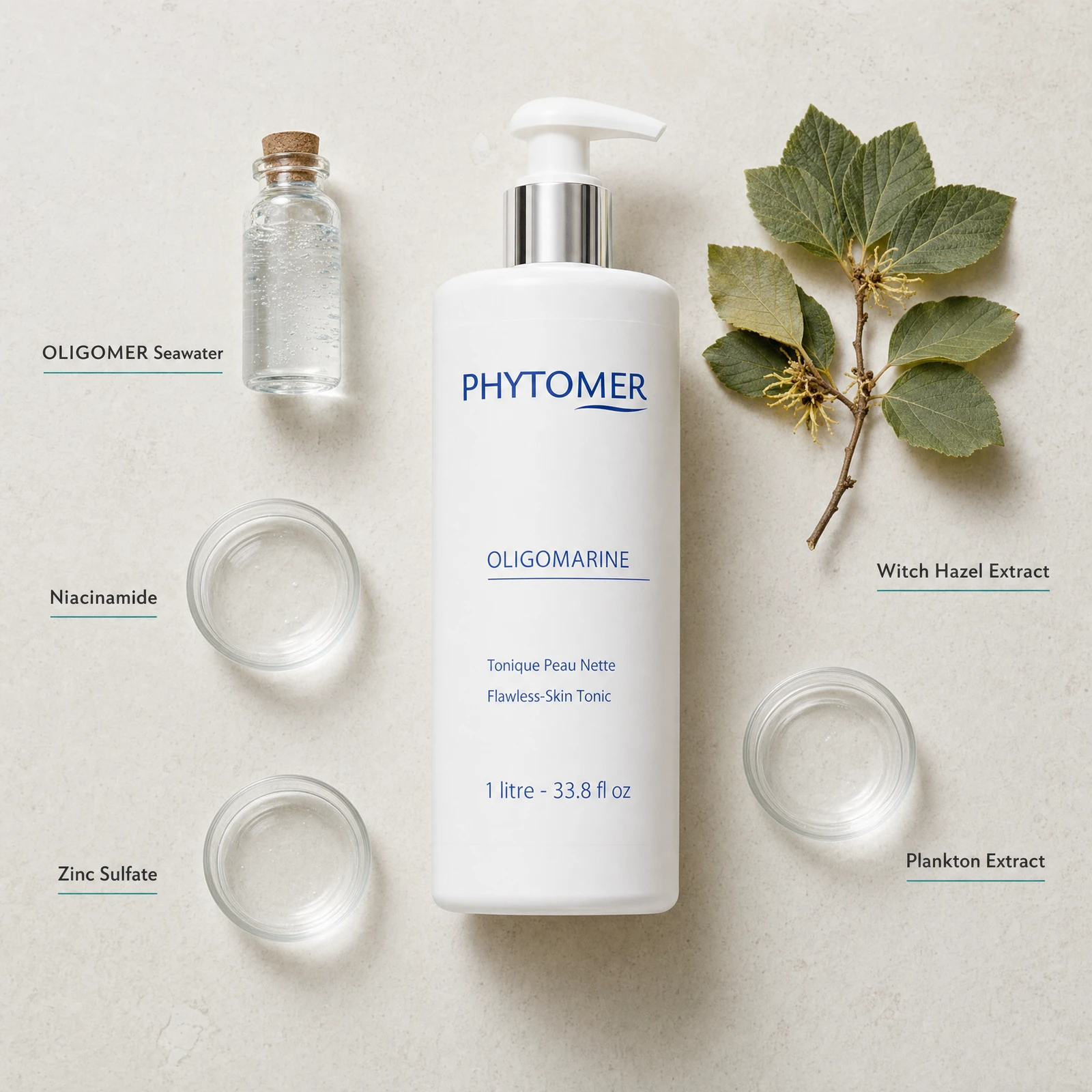 Phytomer Oligomarine Flawless Skin Tonic 1 Litre flatlay on limestone surface with OLIGOMER Seawater, Niacinamide, Zinc Sulfate, Witch Hazel Extract, and Plankton Extract