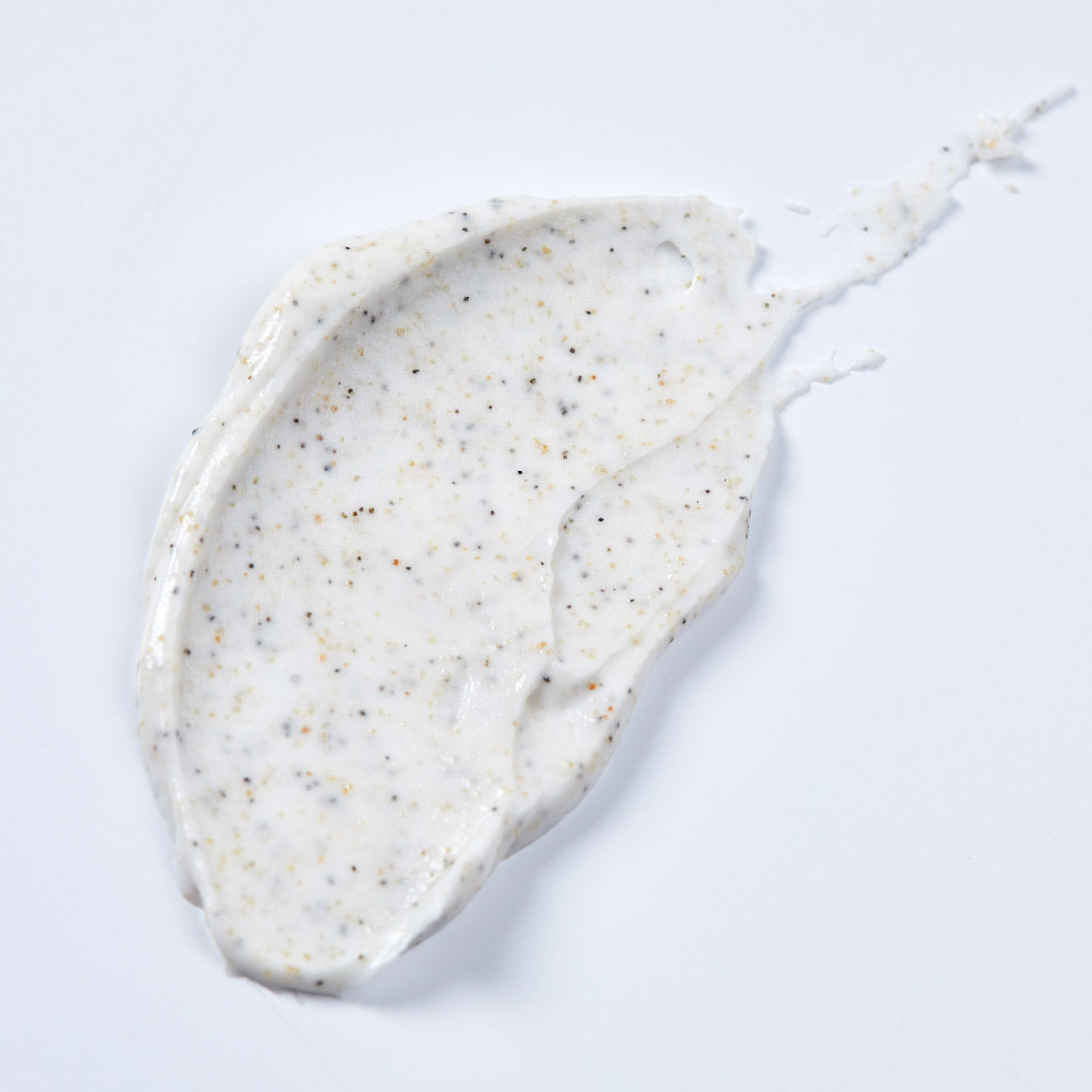 Body scrub cream on a light gray background