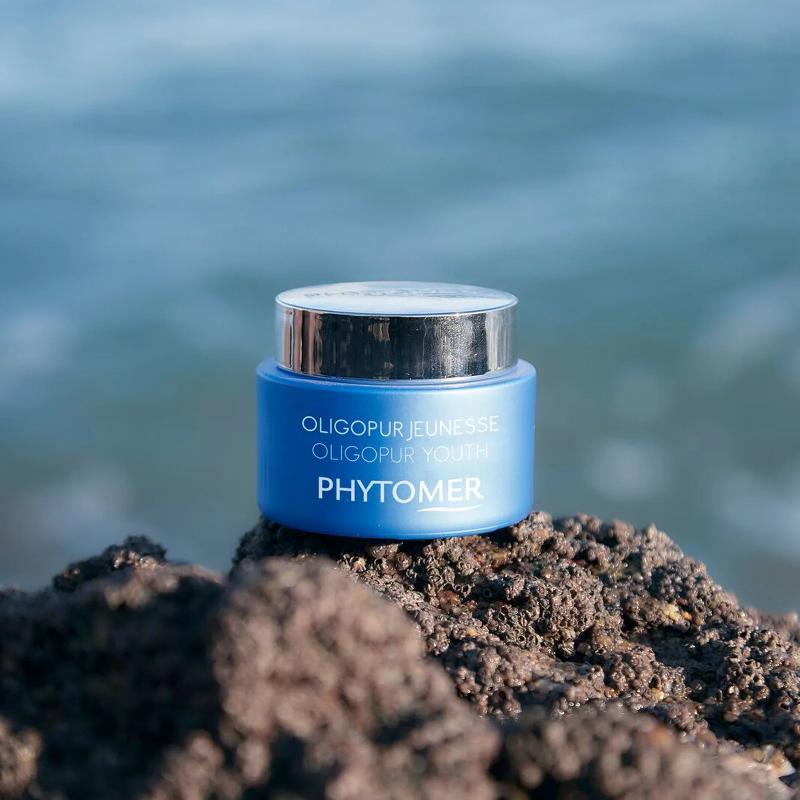Phytomer Oligopur Youth Targeted Cream 50ml on a rocky surface with a blurred natural background