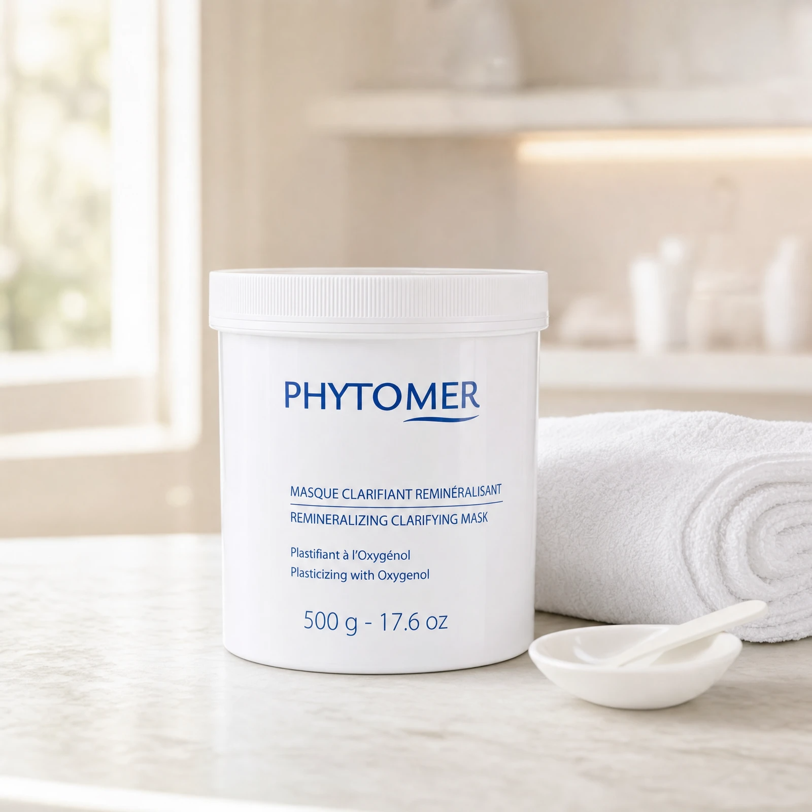 Phytomer Remineralizing Clarifying Mask 500g professional tub on a premium beauty clinic marble counter with white spa towels and ceramic spatula