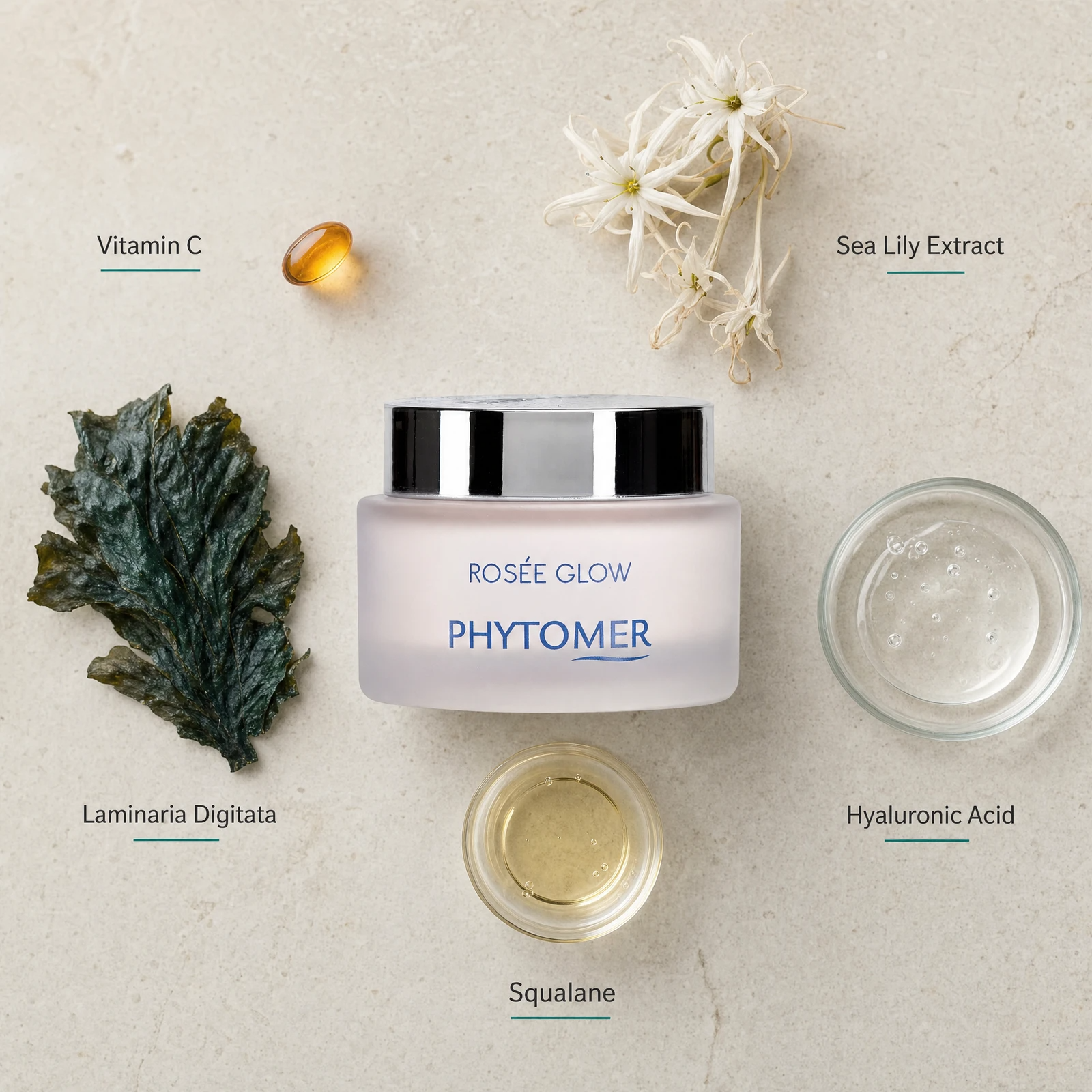 Phytomer Rosée Glow Vitamin Radiance Plumping Cream flatlay on limestone surface with Vitamin C, Sea Lily Extract, Laminaria Digitata, Squalane, and Hyaluronic Acid