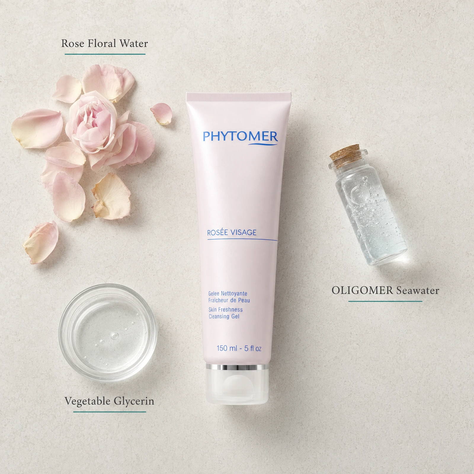 Phytomer Rosee Visage Skin Freshness Cleansing Gel 150ml flatlay on limestone surface with Rose Floral Water, OLIGOMER Seawater, and Vegetable Glycerin