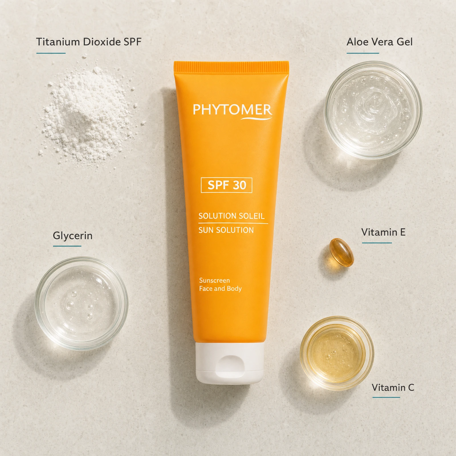 Phytomer Sun Solution Sunscreen SPF30 Face and Body 125ml flatlay on limestone surface with Titanium Dioxide SPF, Aloe Vera Gel, Glycerin, Vitamin E, and Vitamin C