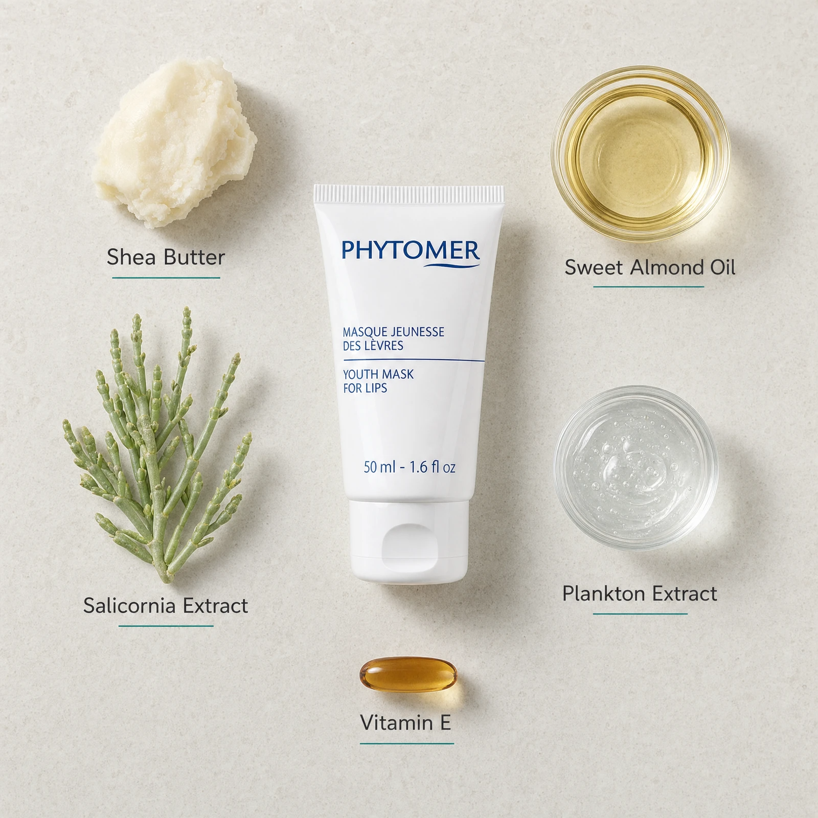 Phytomer Youth Mask for Lips 50ml flatlay on limestone surface with Shea Butter, Sweet Almond Oil, Salicornia Extract, Plankton Extract, and Vitamin E