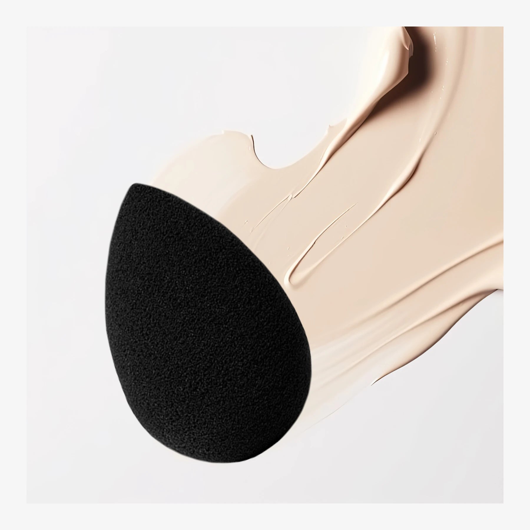 ELES Pro-Blender Sponge  makeup blending sponge with smooth foundation texture swipe on a clean neutral background