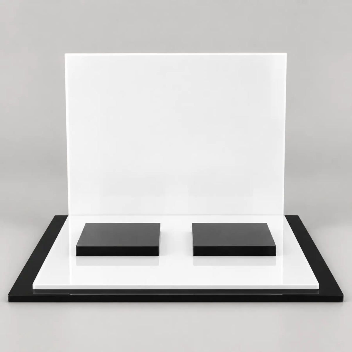 Professional countertop product display stand with white backplate and two square black product risers