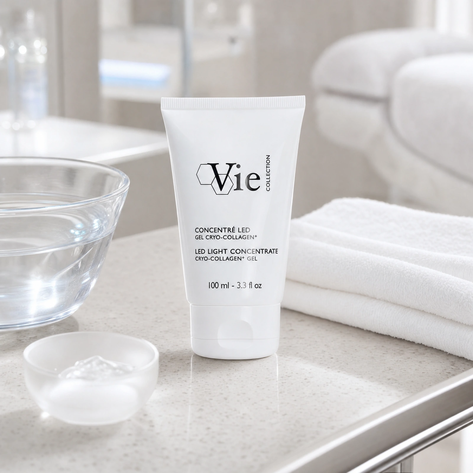 Vie Collection LED Light Concentrate Cryo-Collagen+ Gel 100ml displayed in a premium clinical treatment-room setting for professional firming, radiance and anti-ageing treatments.