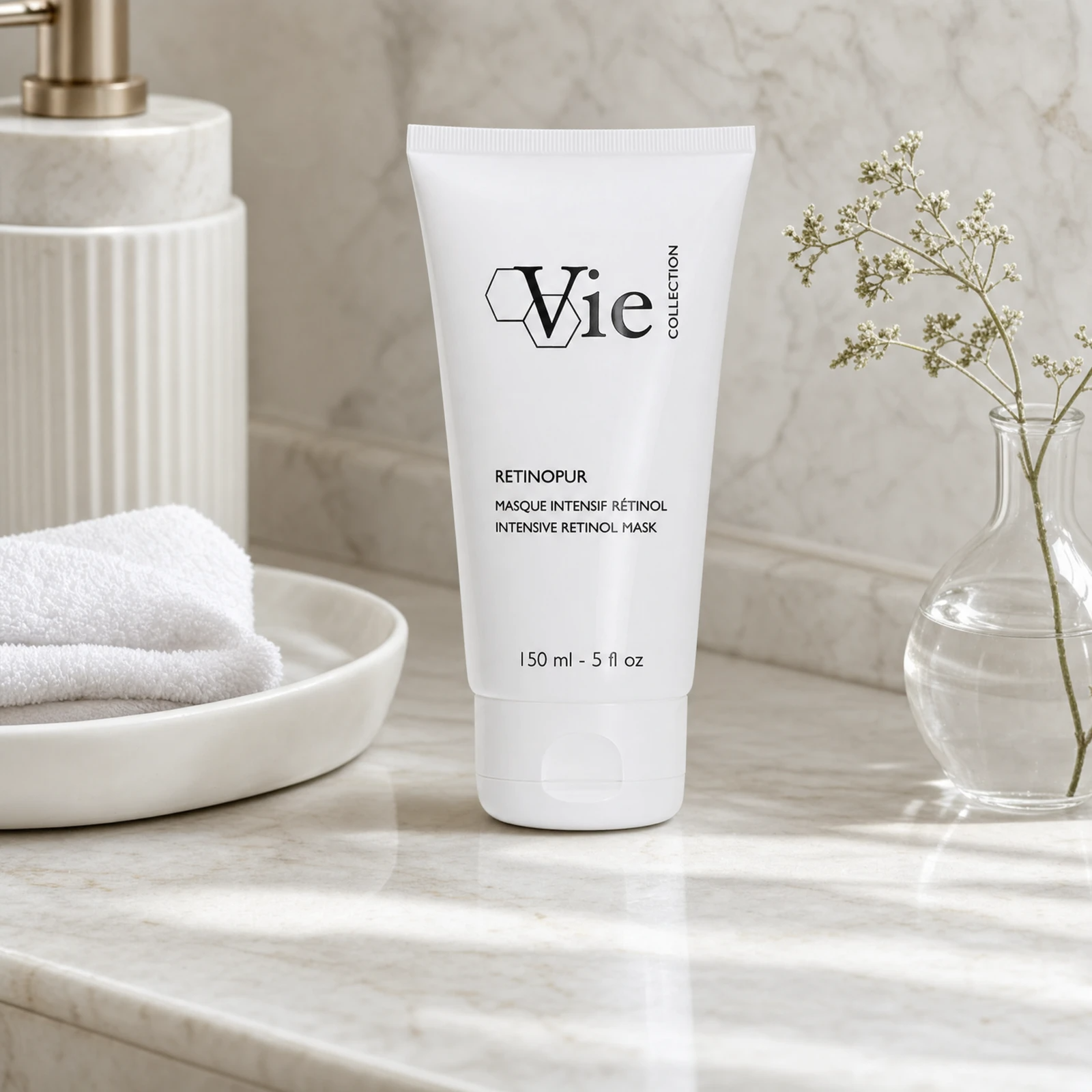 Vie Collection Retinopur Intensive Retinol Mask 150ml on a marble bathroom counter with gypsophila in round glass vase, white ceramic soap dish with towel, ribbed soap dispenser and marble tile wall, premium at-home skincare setting